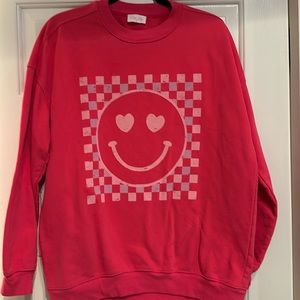 Pink Lily small oversized pink sweatshirt. Smiley face logo. Good condition